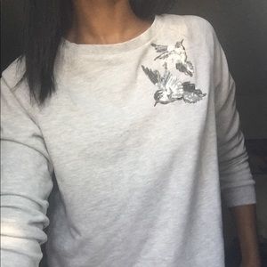 Gray sweatshirt with sequined design